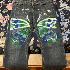 Flared painted butterfly jeans.
